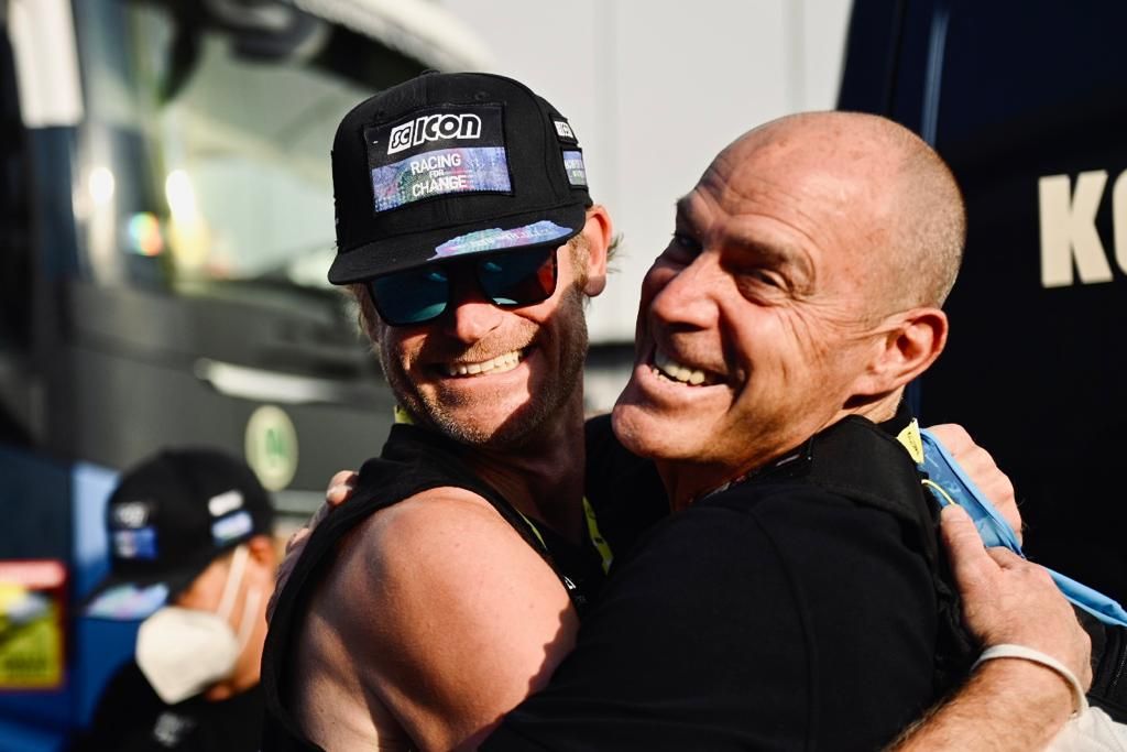 Steve Bauer with another Canadian Israel-Premier Tech staff member after Houle&#039;s Tour de France stage 16 victory