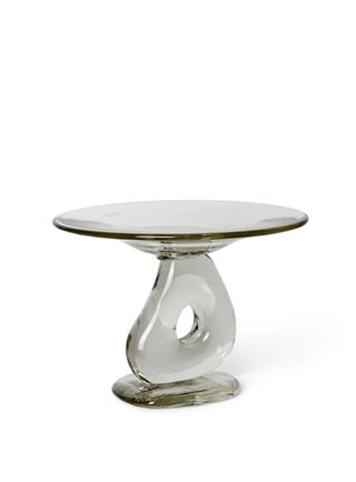 A decorative glass sculpture meant as a high table tray.