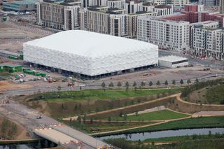 London 2012 Aquatics Centre by Zaha Hadid: The Basketball Arena in front of the Olympic Village