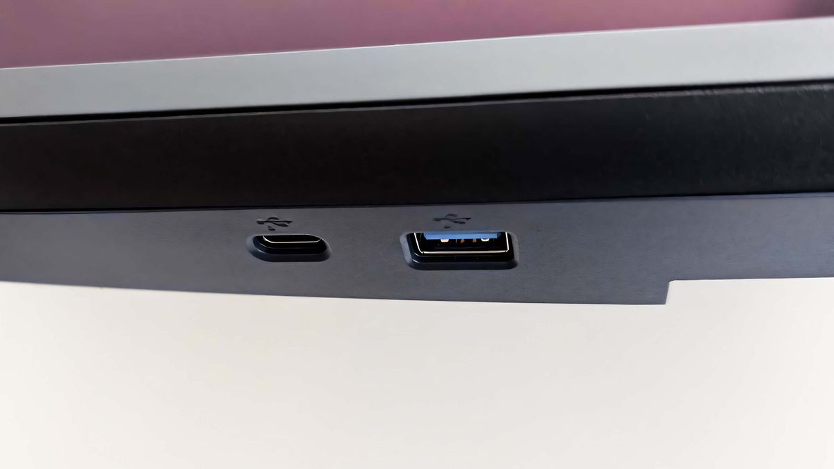 A closeup of the Alienware 34 Curved QD-OLED AW3425DW's USB-C and USB-A ports on the bottom hub.