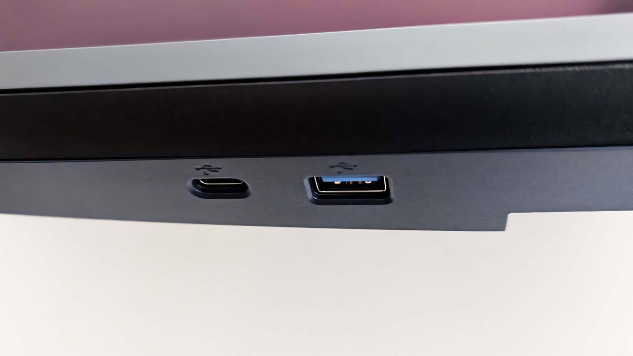 A closeup of the Alienware 34 Curved QD-OLED AW3425DW's USB-C and USB-A ports on the bottom hub.
