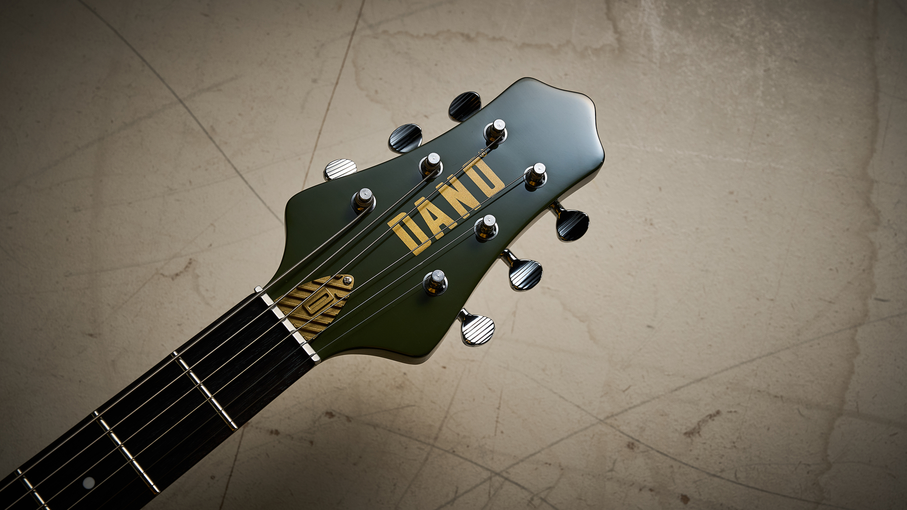 The headstock of the Danelectro Dan O Cool Baritone guitar