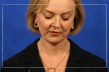 an extreme close up of Liz Truss's face looking down 