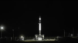 A Rocket Lab Electron rocket stands at Launch Complex 1 on New Zealand's Mahia Peninsula during fueling operations for launch on Aug. 17, 2019 local time (Aug. 16 EDT/GMT). The launch was delayed by high winds.