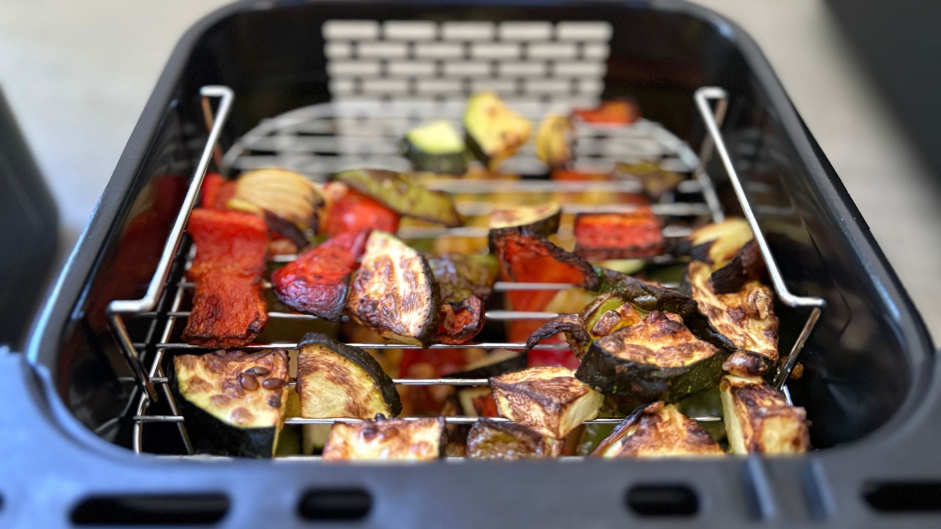 Two layers of vegetables in the Salter VertiCook Air Fryer
