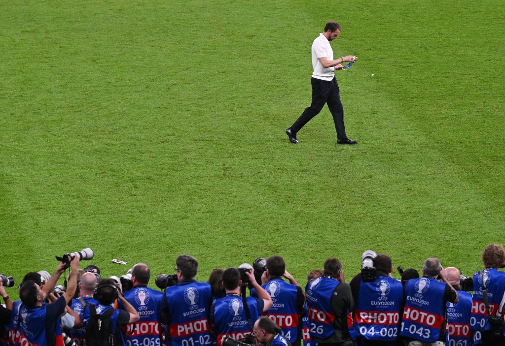 Gareth Southgate, Head Coach of England, looks dejected as he looks at his Runners Up Medal as he leaves the field after the UEFA EURO 2024 final match between Spain and England at Olympiastadion on July 14, 2024 in Berlin, Germany