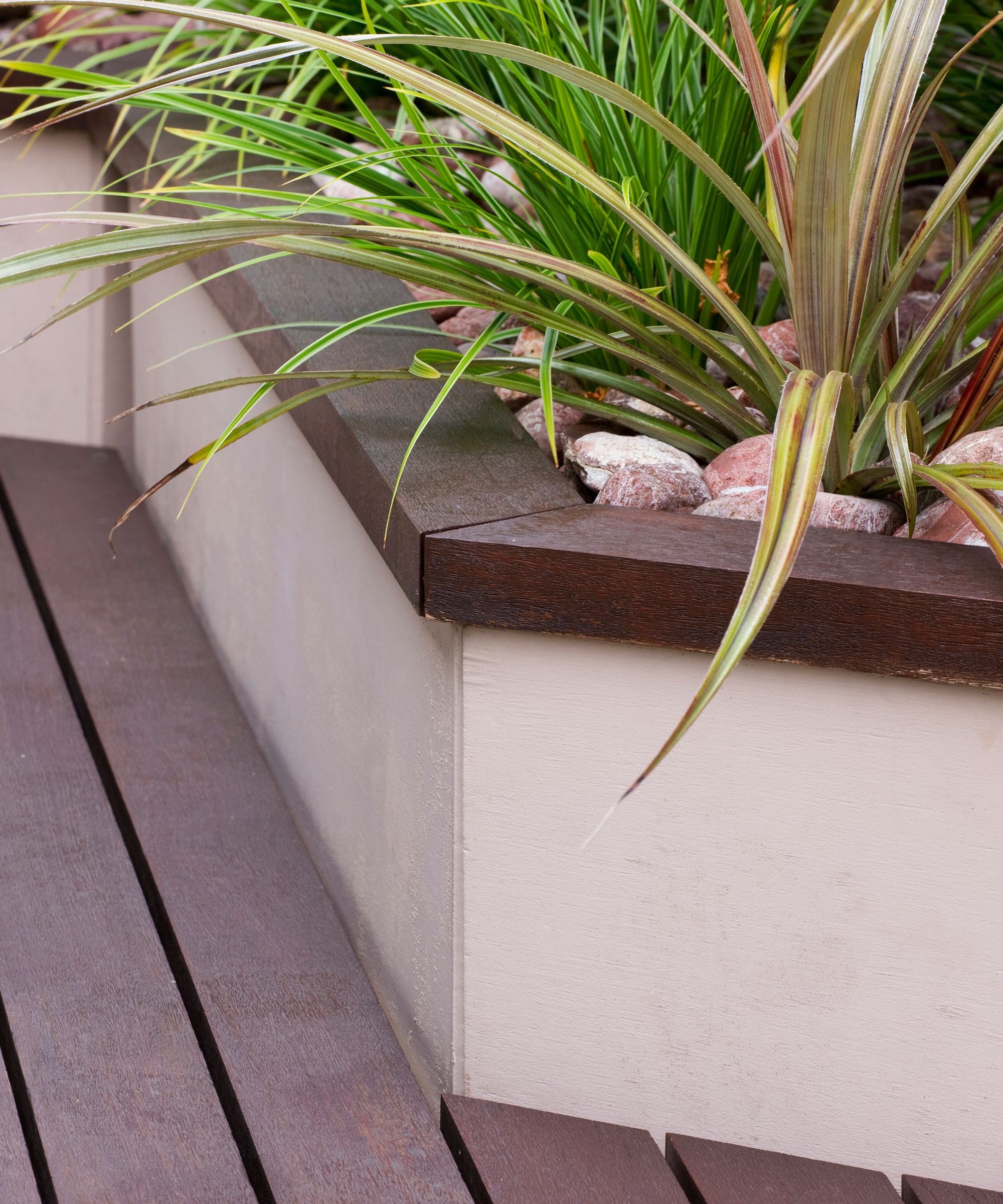 raised bed on deck planted with ornamental grasses