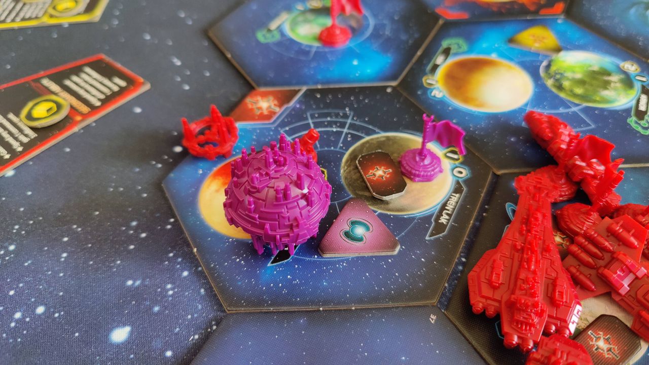 Twilight Imperium ship models on board tiles, against a starry background