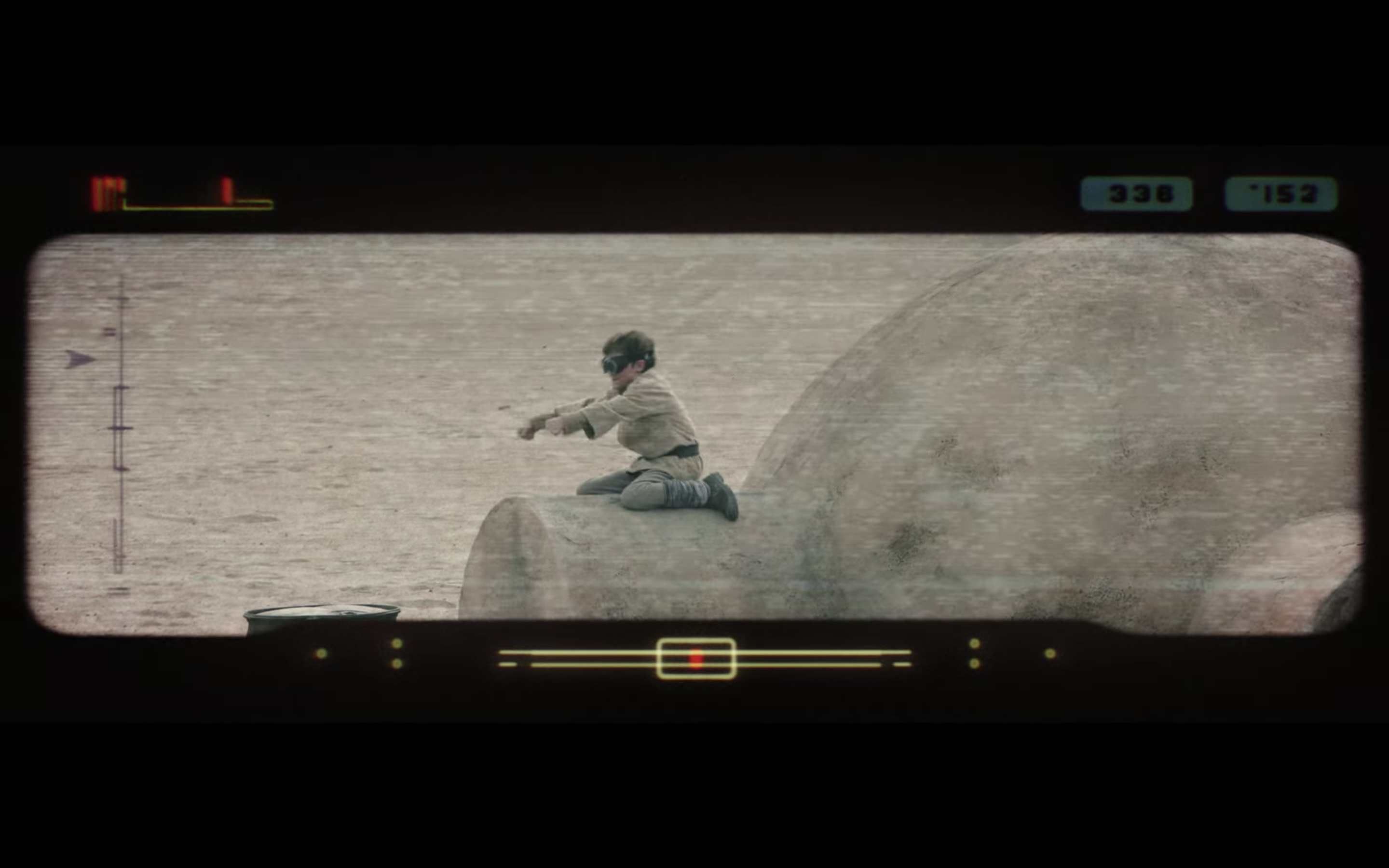 Young Luke Skywalker (looking like he's pretending to race) on the top of his home in Tatooine