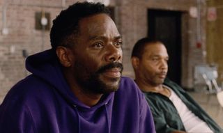 colman domingo in a purple sweatshirt in a prison group talk session in sing sing