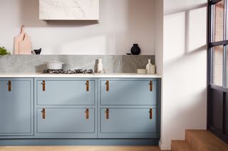 small kitchen with pastel blue cabinets by Life Kitchens
