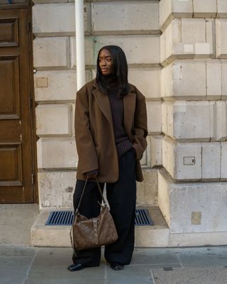 @_livmadeline wears chocolate brown jumper, an oversized blazer, tailored trousers and boots