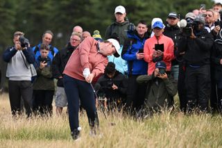 Robert MacIntyre strikes a wood out of the thick rough