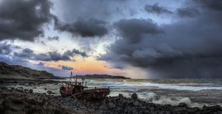 ship wreck and storm against the sunset