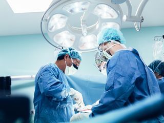 Surgeons at surgery table