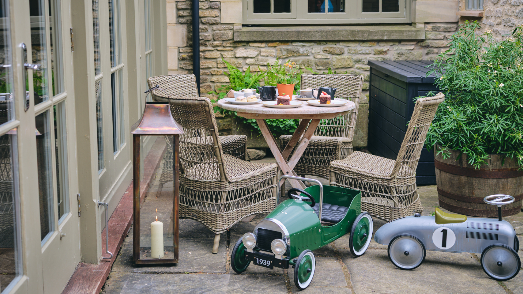 Calcot & Spa outdoor area with kids' cars.