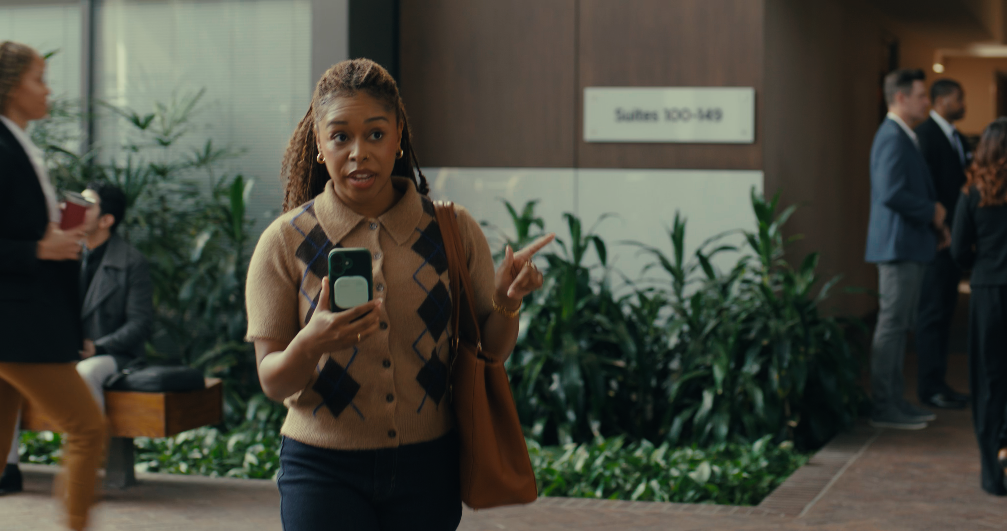 SpeakON MagSafe AI button in use by business professions using iPhones.