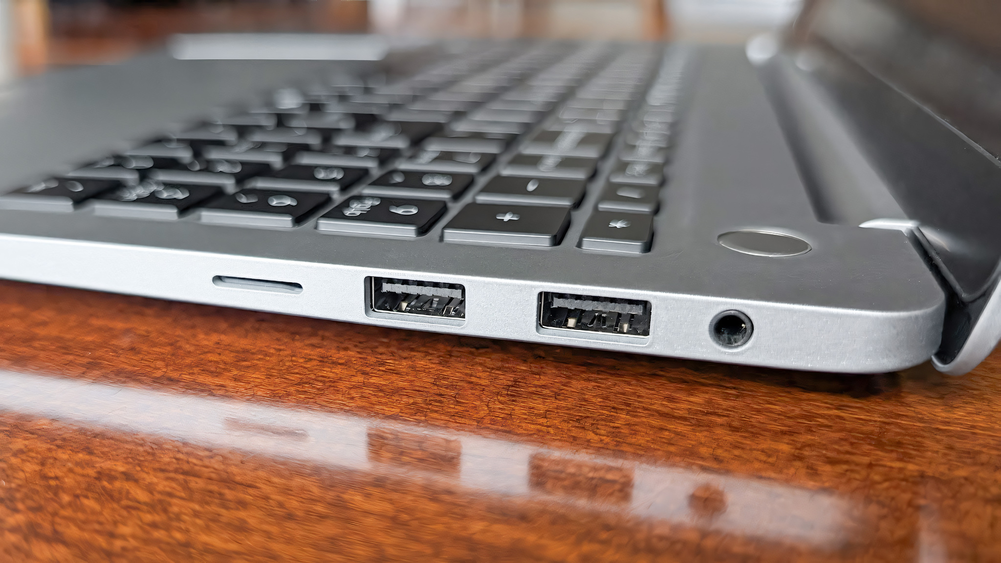 Closeup of the microSD card reader, two USB-A ports, and audio jack on the Geekom GeekBook X16 Pro's left side.  