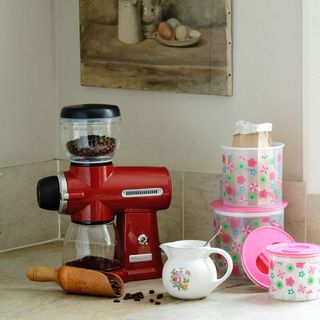kitchen room wih red coffee maker machine and white china jug
