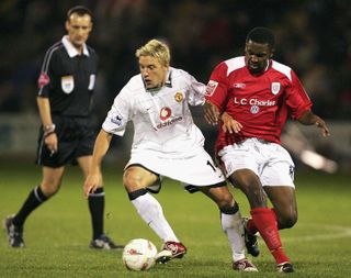 Justin Cochrane challenges Alan Smith during a clash between Manchester United and Crewe Alexandra back in 2004