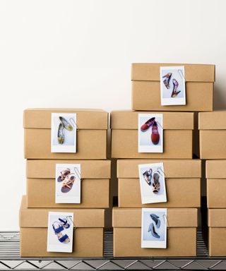 shoe boxes stacked together with image labels