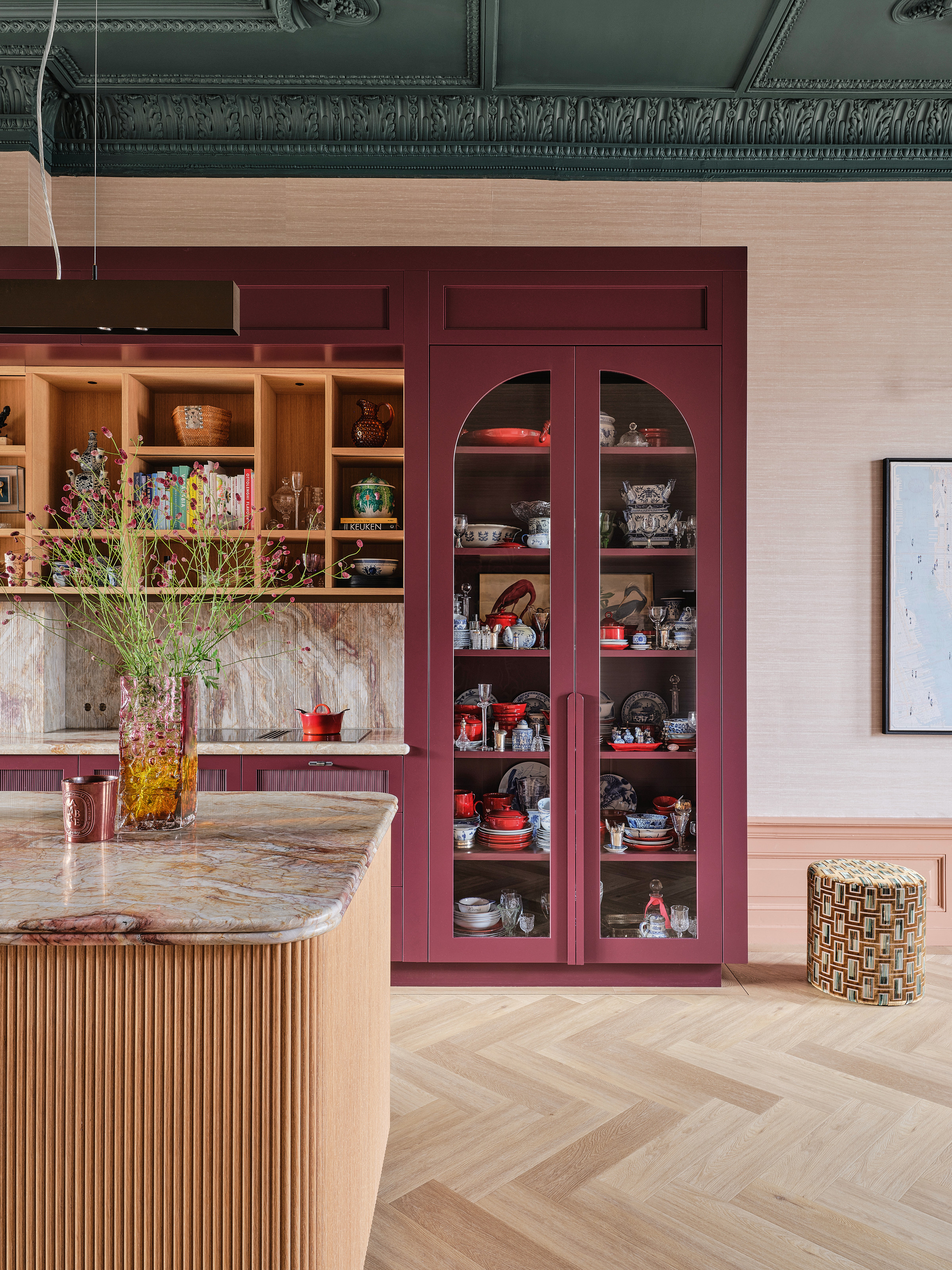 Plum kitchen with arched doors and light oak accents