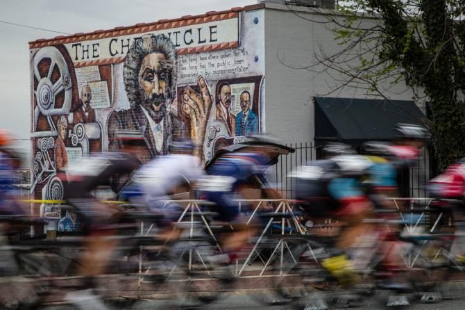 Riders pass by some of downtowns artwork.