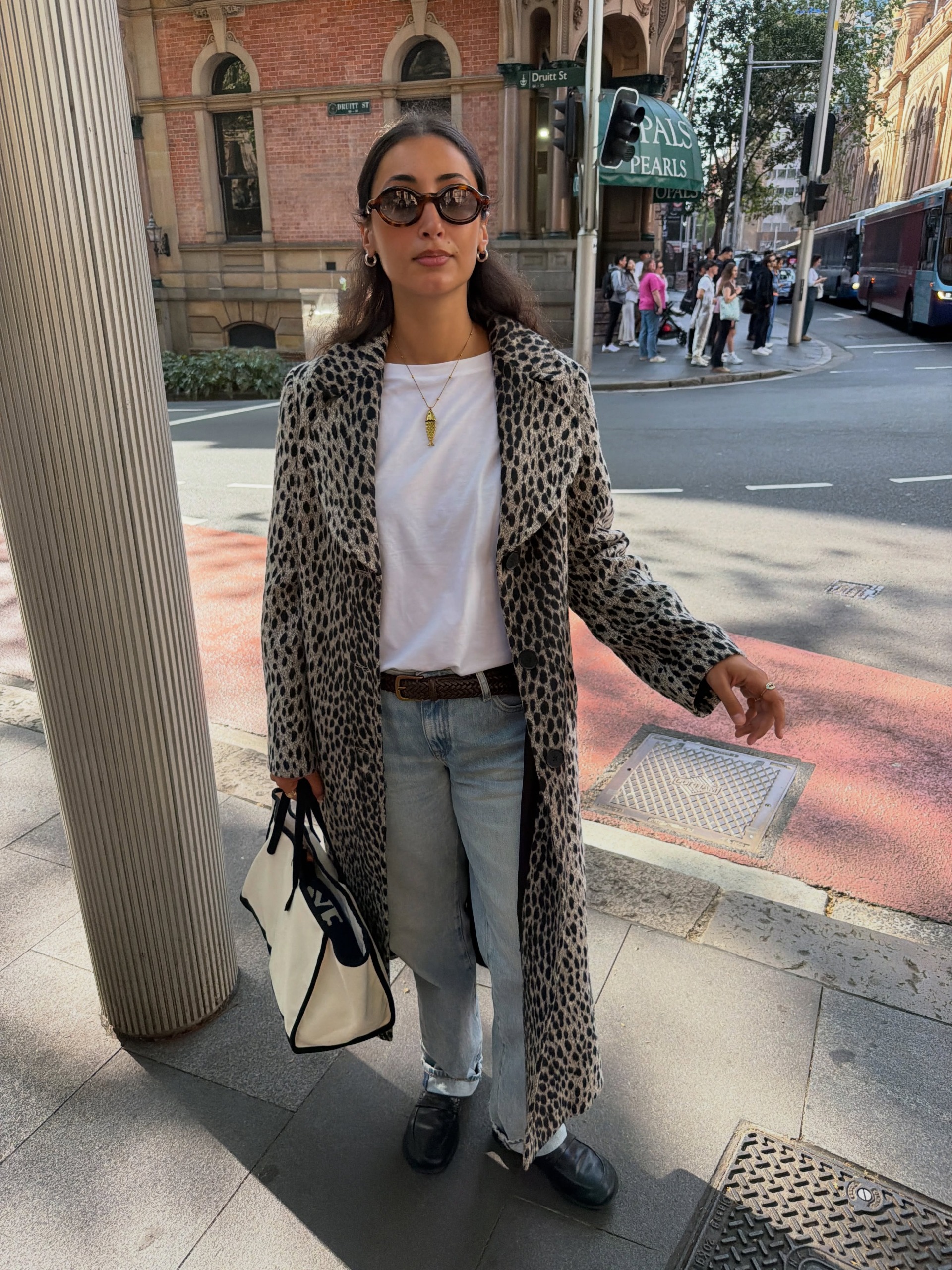 An image of a woman showcasing how to style fall basics 2026