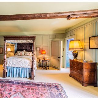 four poster bed large wooden ceiling beam and walnut chest of drawers leave us in no doubt of this homes amazing heritage