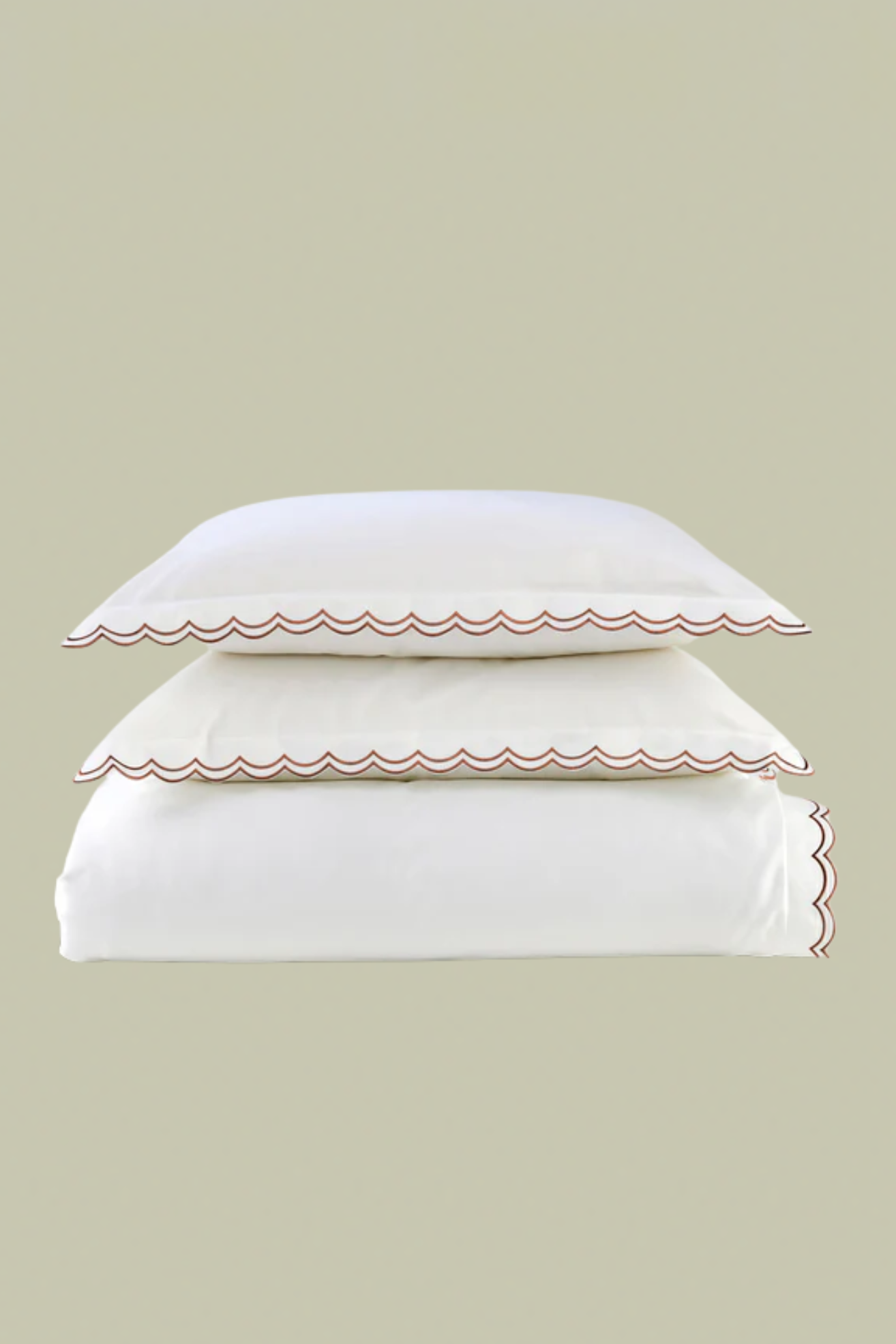 White bedding with red scalloped piping