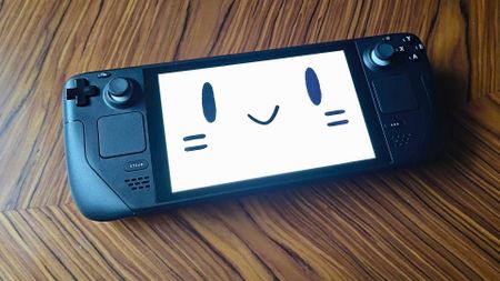Steam Deck with mascot face on screen