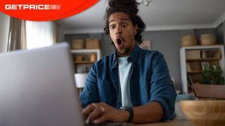 Man looking surprised looking at laptop screen with red GetPrice logo on top left corner