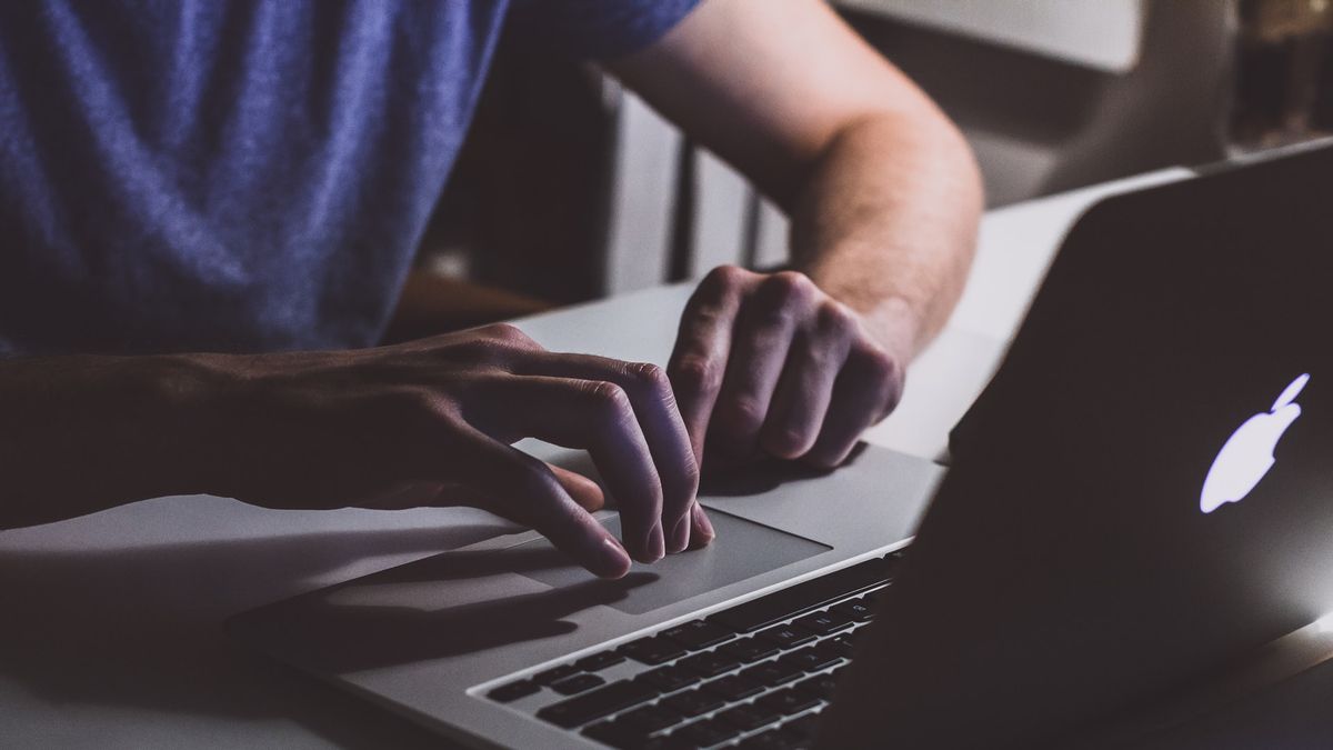 Man reading on computer