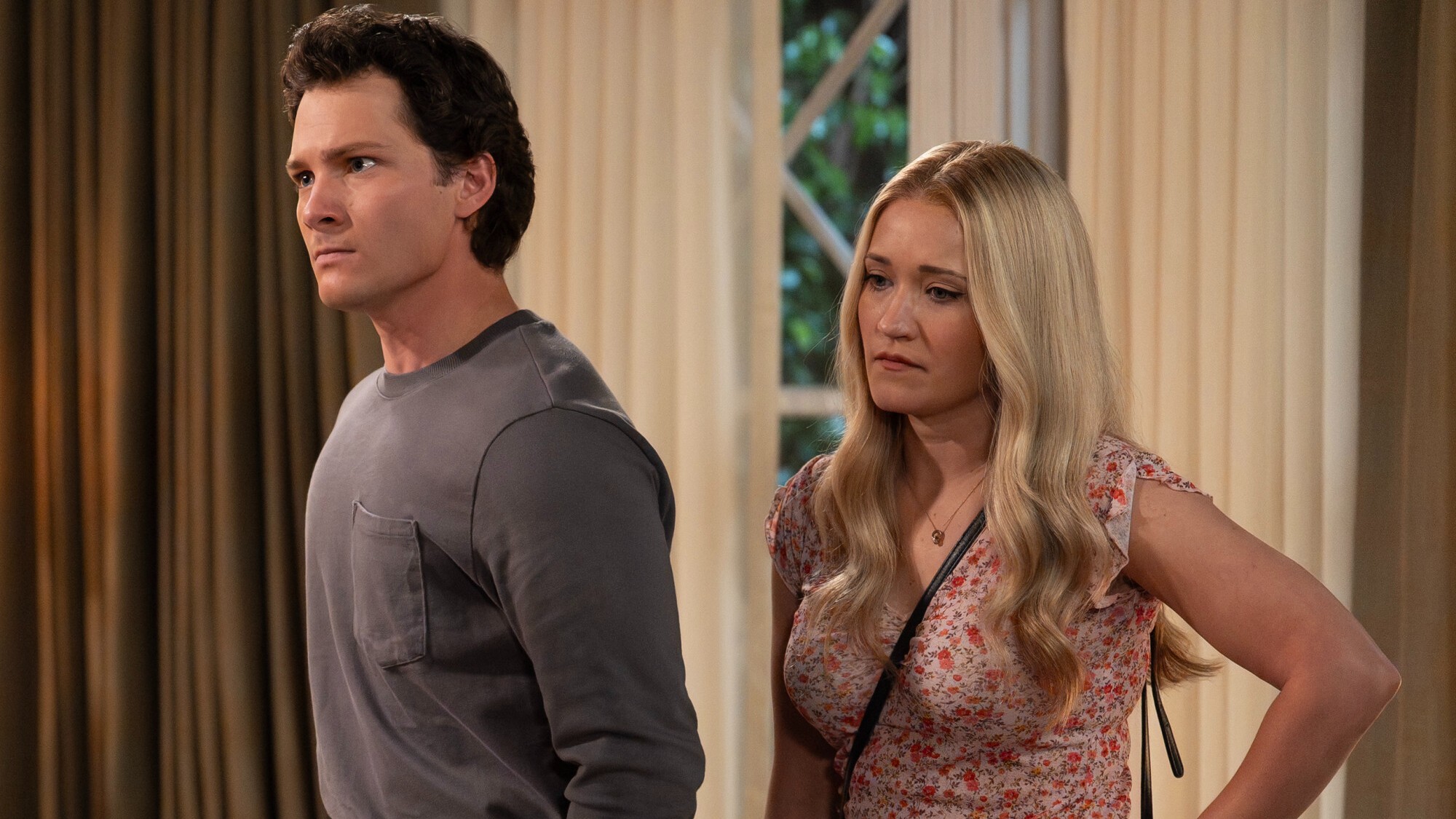 Georgie &amp; Mandy are confronting Mary in this picture. Georgie looks upset and is wearing a grey long-sleeved shirt. Mandy is looking down and looks sad. 
