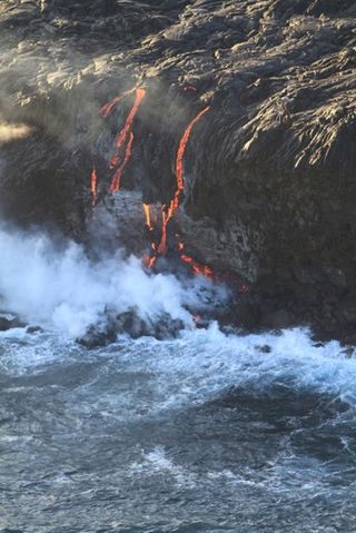 Kilauea lava overflows cliff