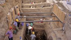 A group of people excavate a house
