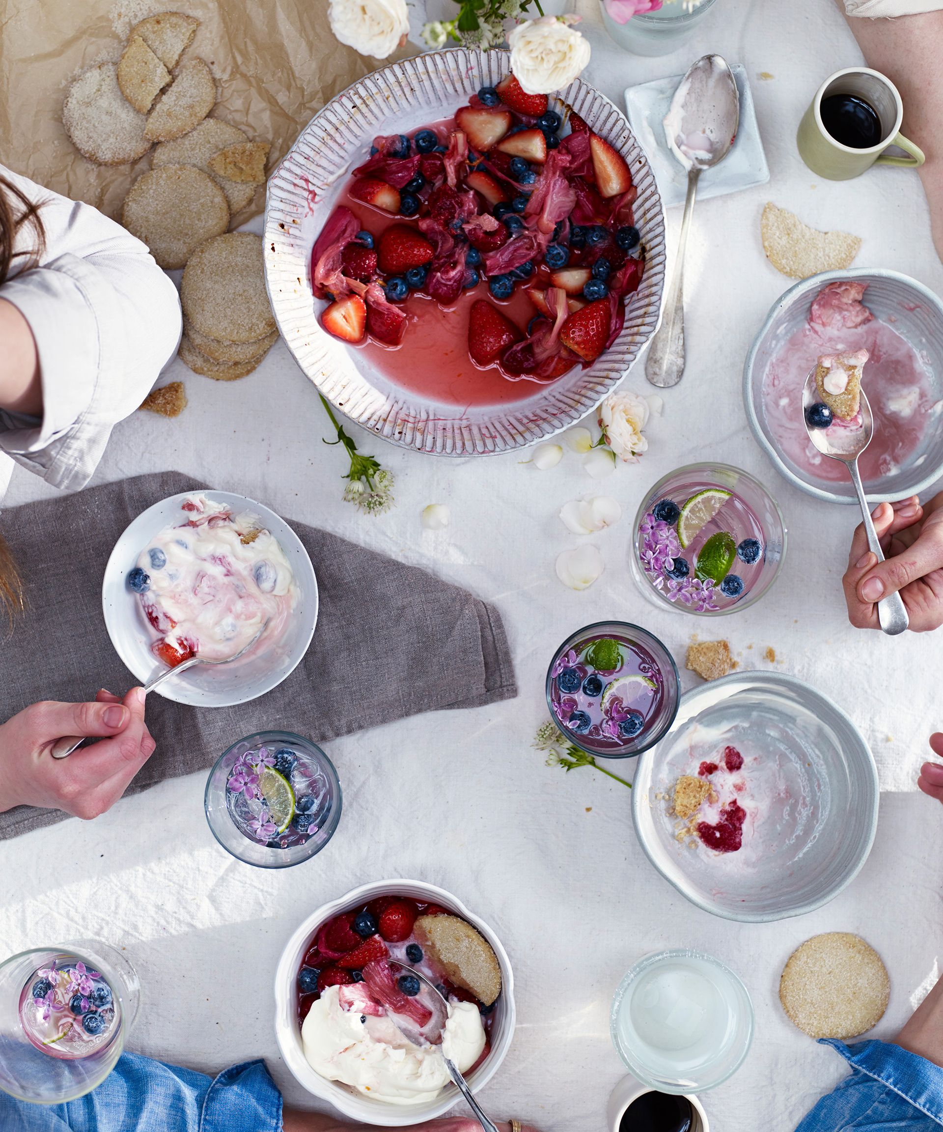 An example of pool party ideas showing a birds eye view of a table with owls of dessert