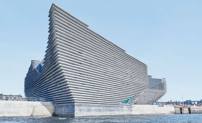 V&A Dundee exterior view with water in front of it..