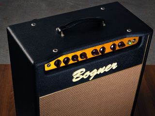 The front panel features classy oxblood control knobs on a gold anodised chassis