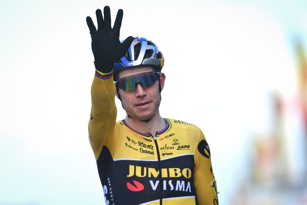 Belgian Wout Van Aert celebrates as he crosses the finish line to win the men&#039;s elite race during the 2022 Belgian Cyclocross Championships 