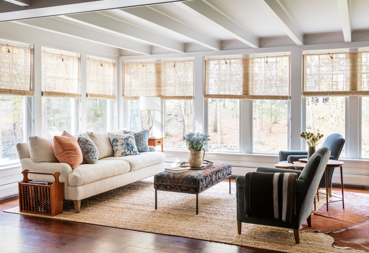 a modern sunroom with traditional style furniture