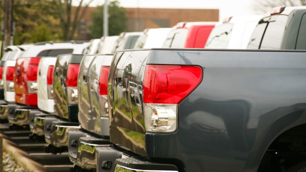 Pickup trucks lined up.