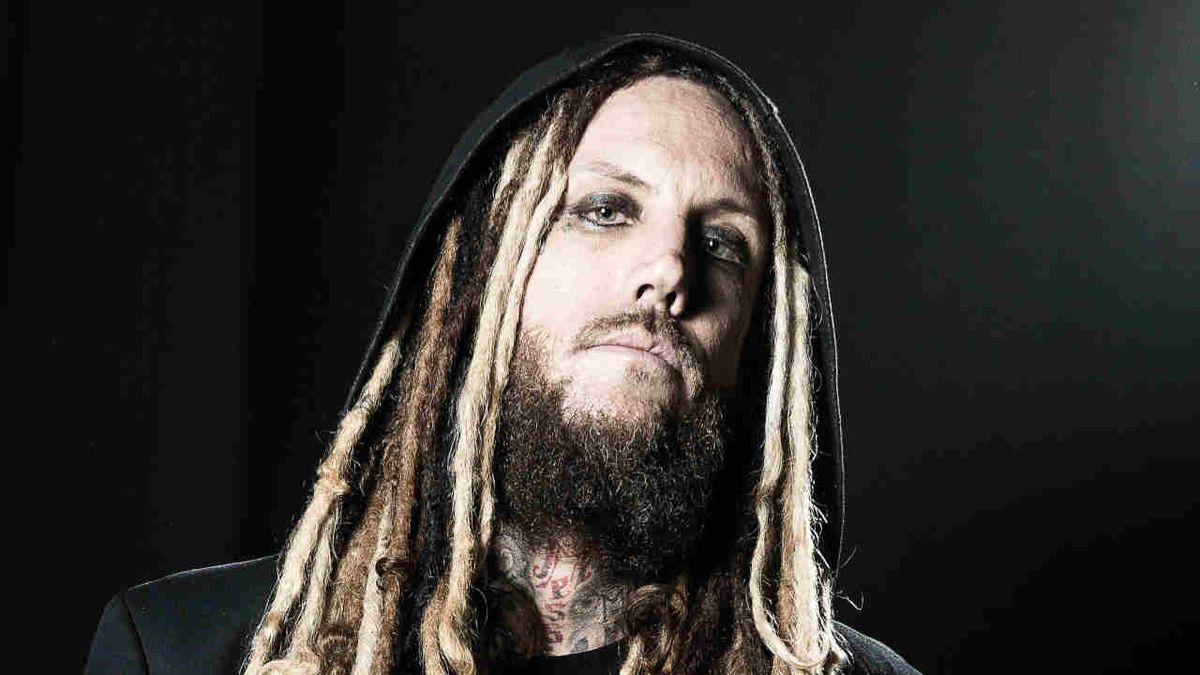 Korn guitarist Head photographed against a black background