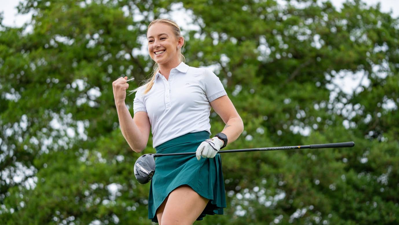 Female golfer wearing a Shot Scope watch