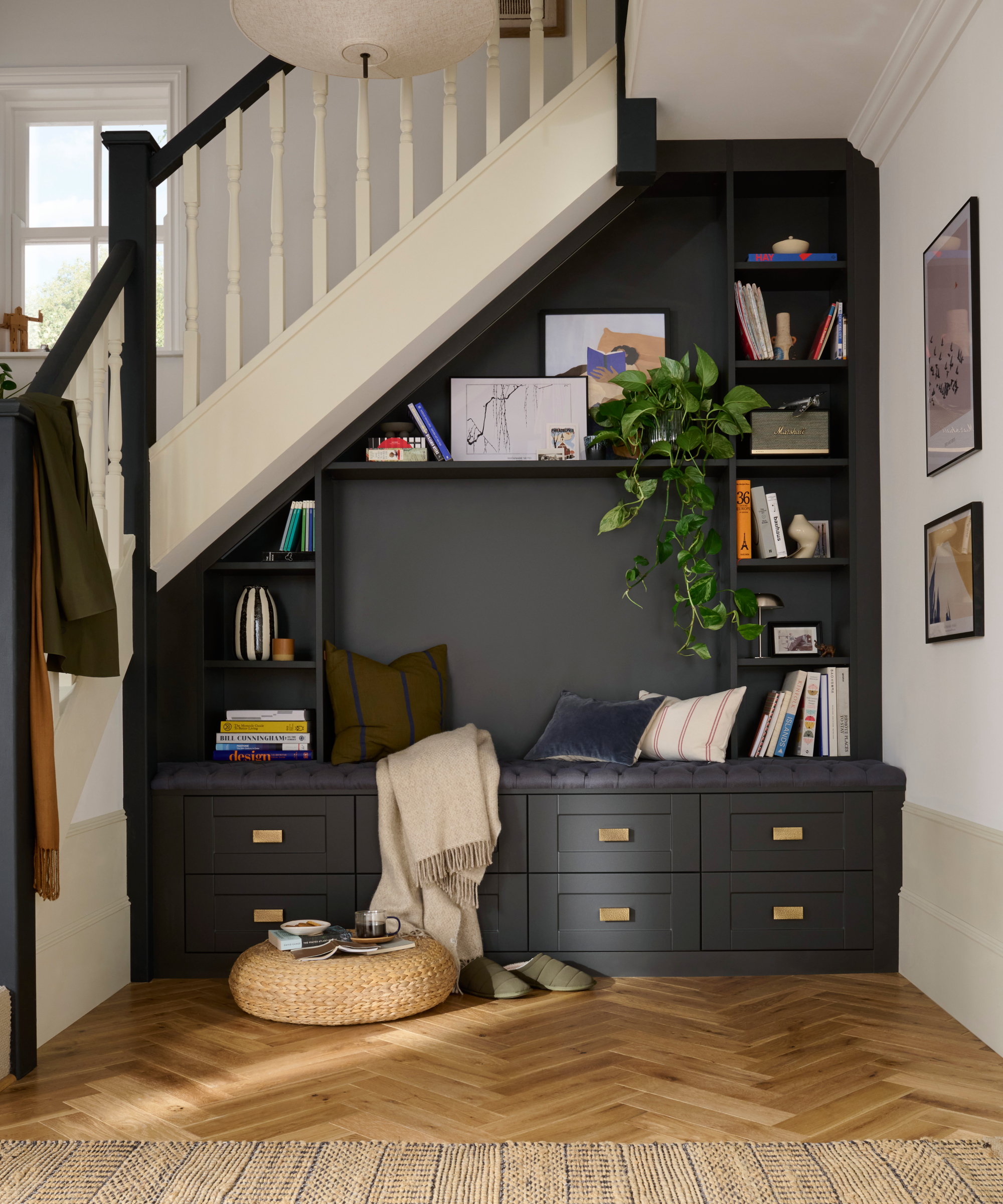 built in understairs storage with shelves, drawers and seating area