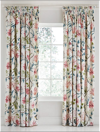 Sanderson Clementine Lined Curtains slightly open, with a pink and green tropical pattern of humming birds and exotic flora