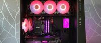 A closeup of a PC build with lots of RGB lighting in an In Win PC case, this is an example of the kind of PC build you could put together if you're out of the budget realm.