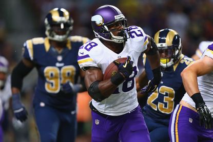 Adrian Peterson playing for the Minnesota Vikings in 2014