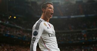 Cristiano Ronaldo of Real Madrid CF celebrates as he scores their second goal during the UEFA Champions League Round of 16 second leg match between Real Madrid CF and FC Schalke 04 at Estadio Bernabeu on March 10, 2015 in Madrid, Spain.