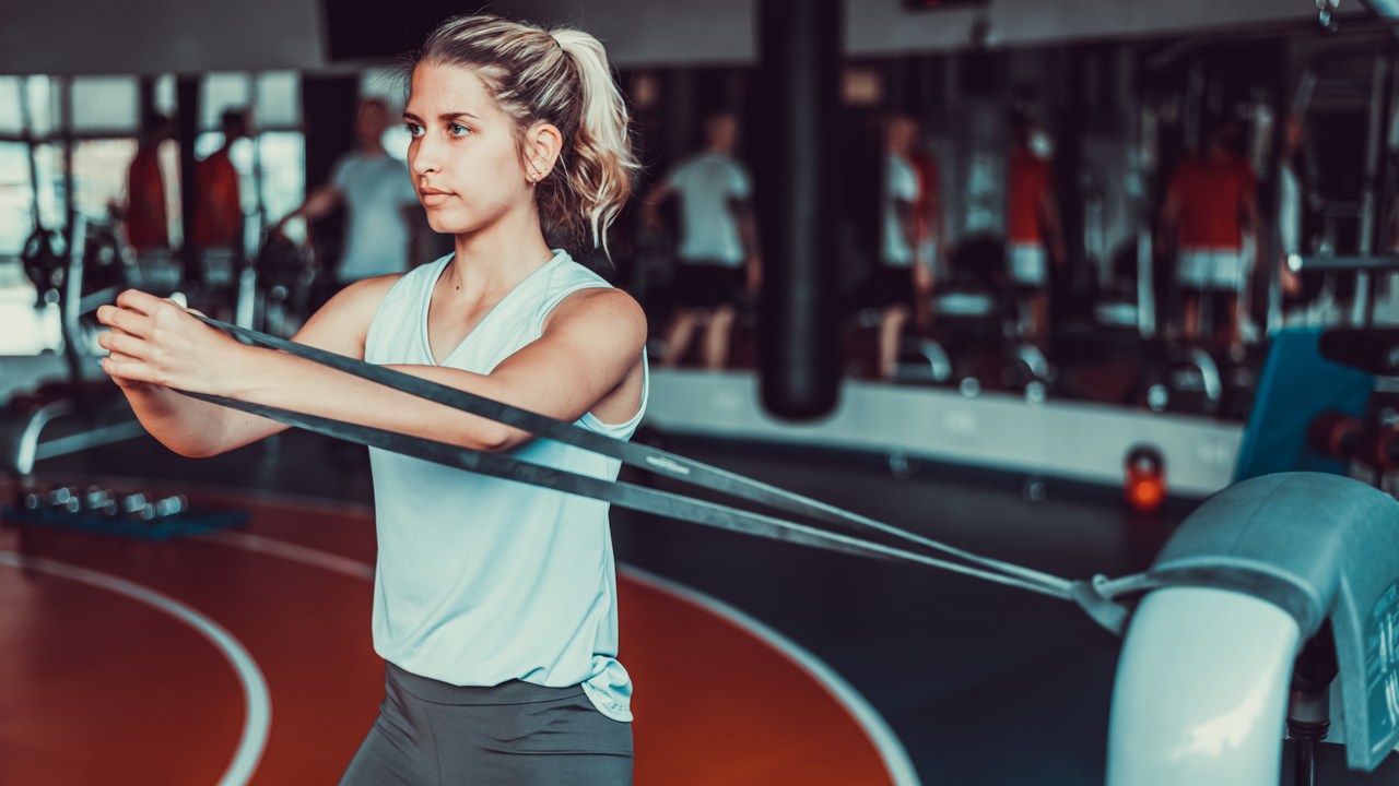 Woman doing resistance band core workout